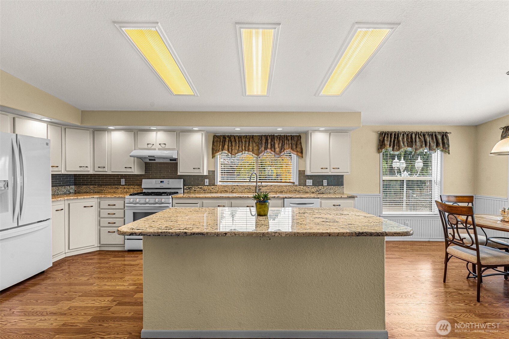 420 Sunnyslope Heights Road Wenatchee, WA 98801 - Photo 14 of 40 a large kitchen with kitchen island a large window a sink and a counter space