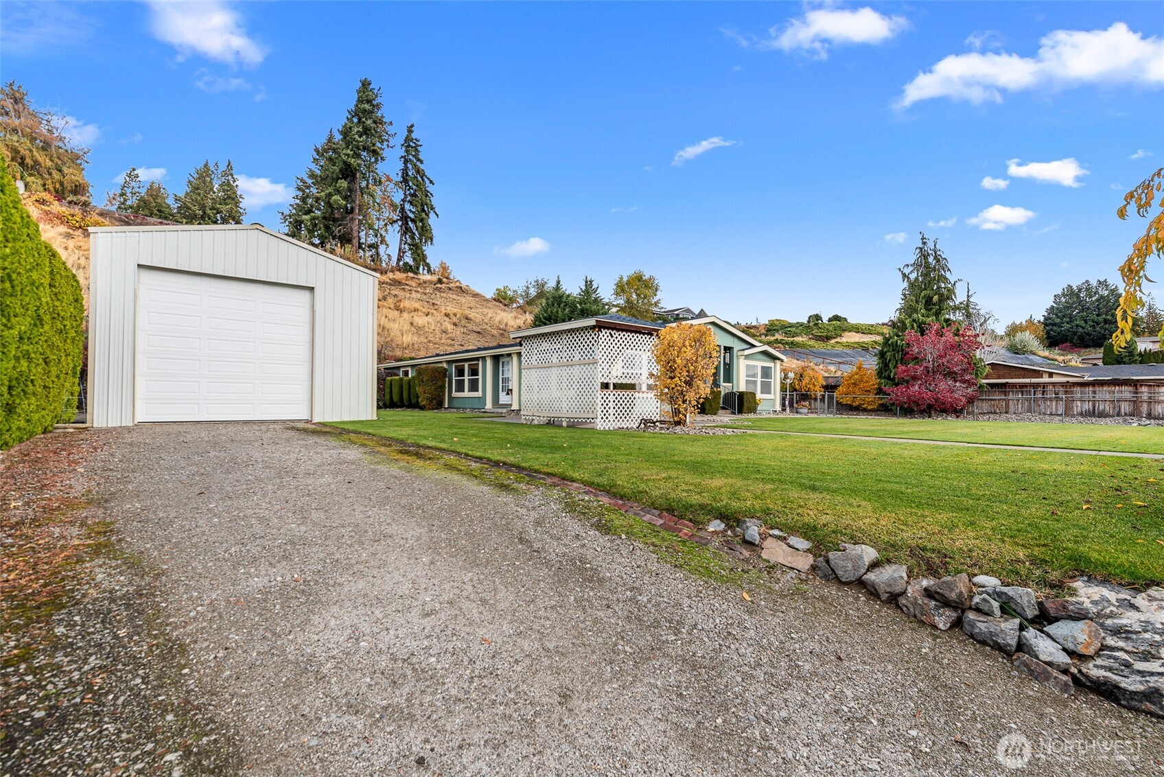 420 Sunnyslope Heights Road Wenatchee, WA 98801 - Photo 2 of 40 a front view of a house with garden