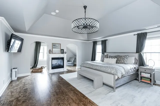 a bathroom with a double vanity sink a toilet a mirror and shower