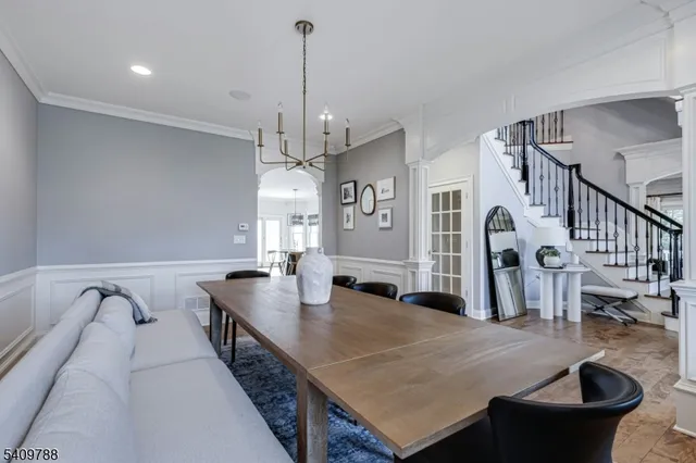 a dining room with furniture and wooden floor