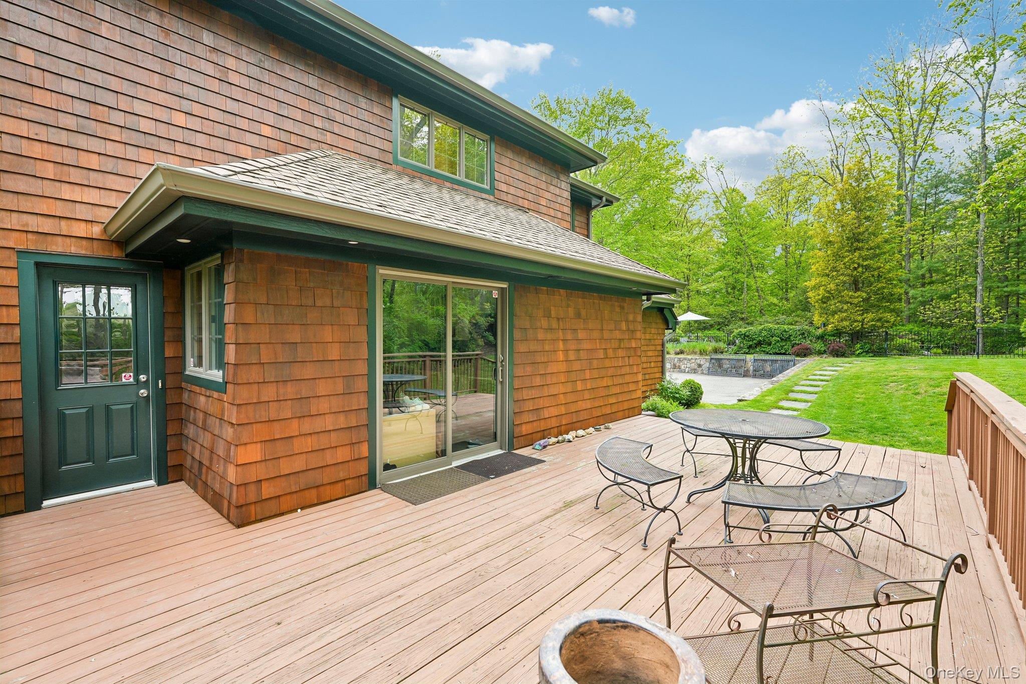 27 Cat Ridge Road North Salem, NY 10560 - Photo 41 of 49 a view of a wooden chairs and table in patio