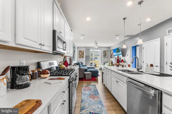 a kitchen that has a lot of cabinets in it