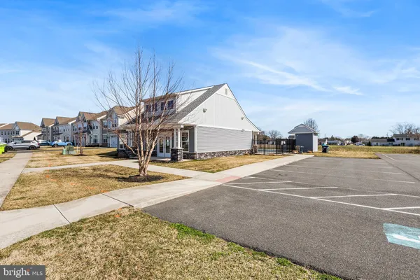 a view of multiple houses with a yard
