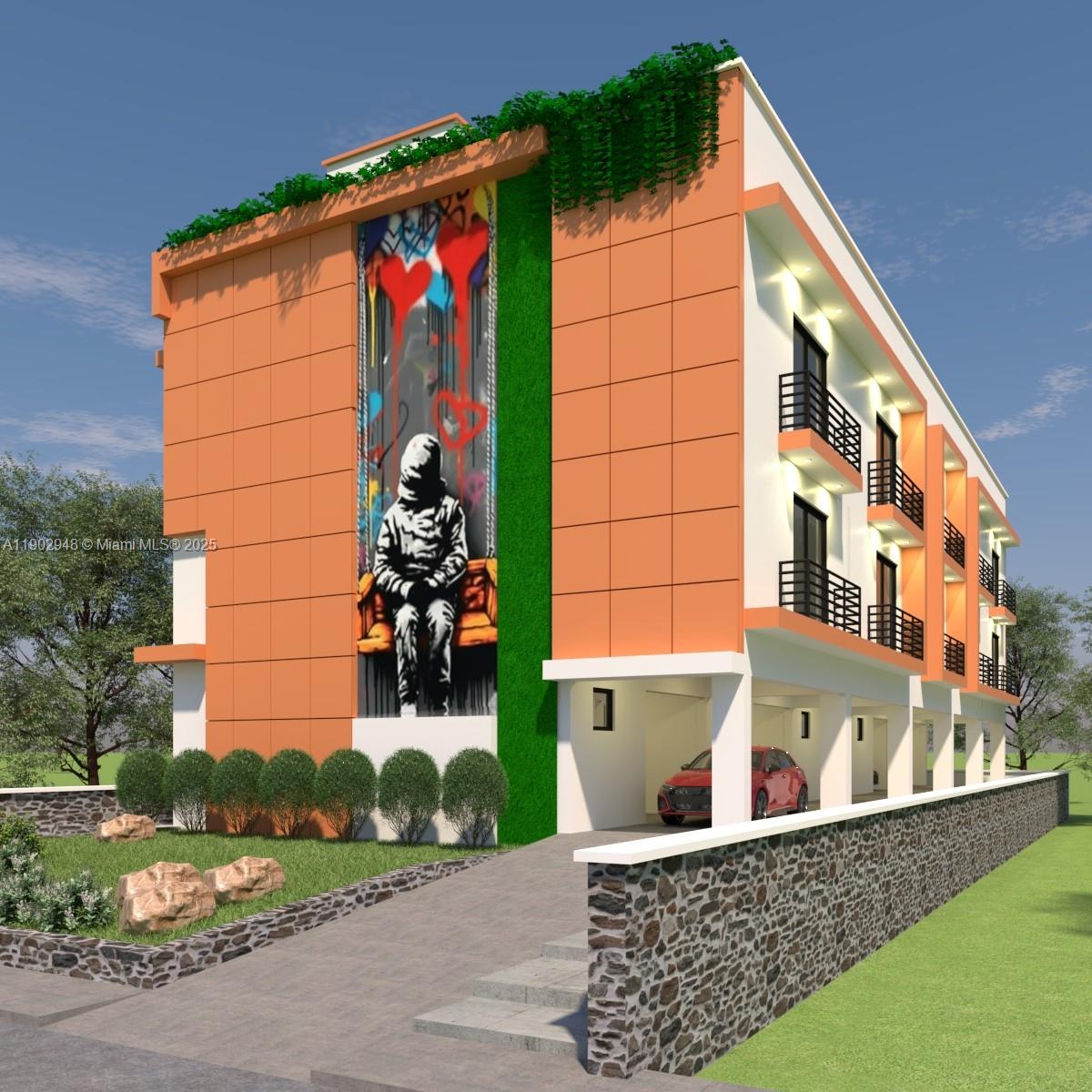 264 Northwest 33rd Street Miami, FL 33127 - Photo 2 of 6 a view of a house with a small yard and potted plants