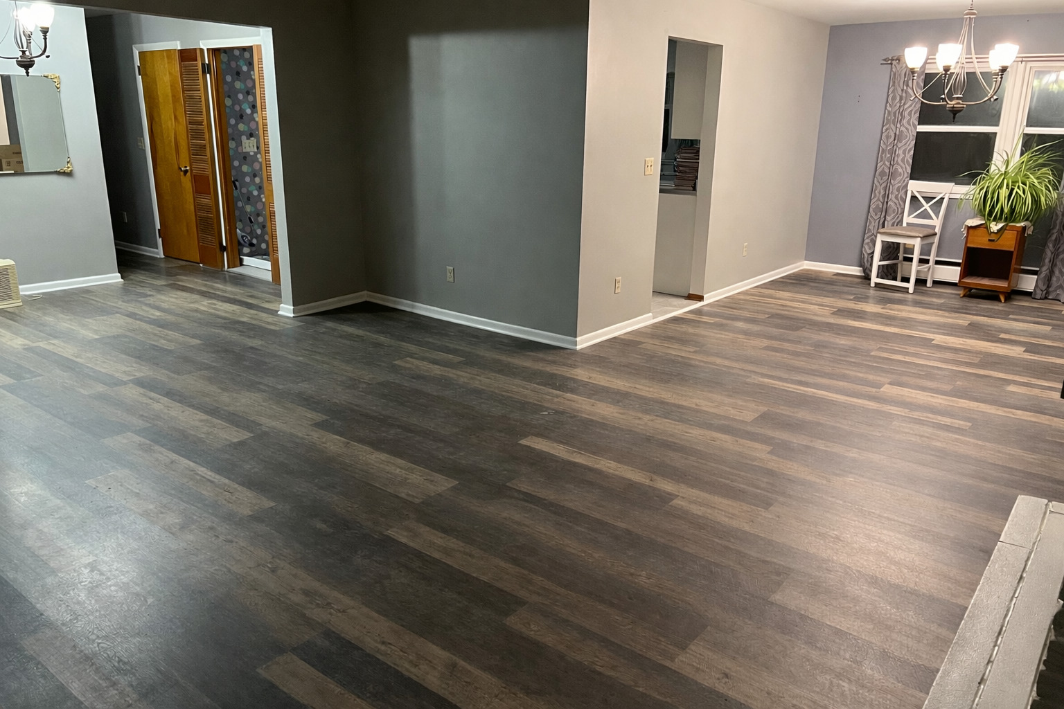 125 West Exchange Street Danvers, IL 61732 - Photo 13 of 66 an empty room with wooden floor and windows