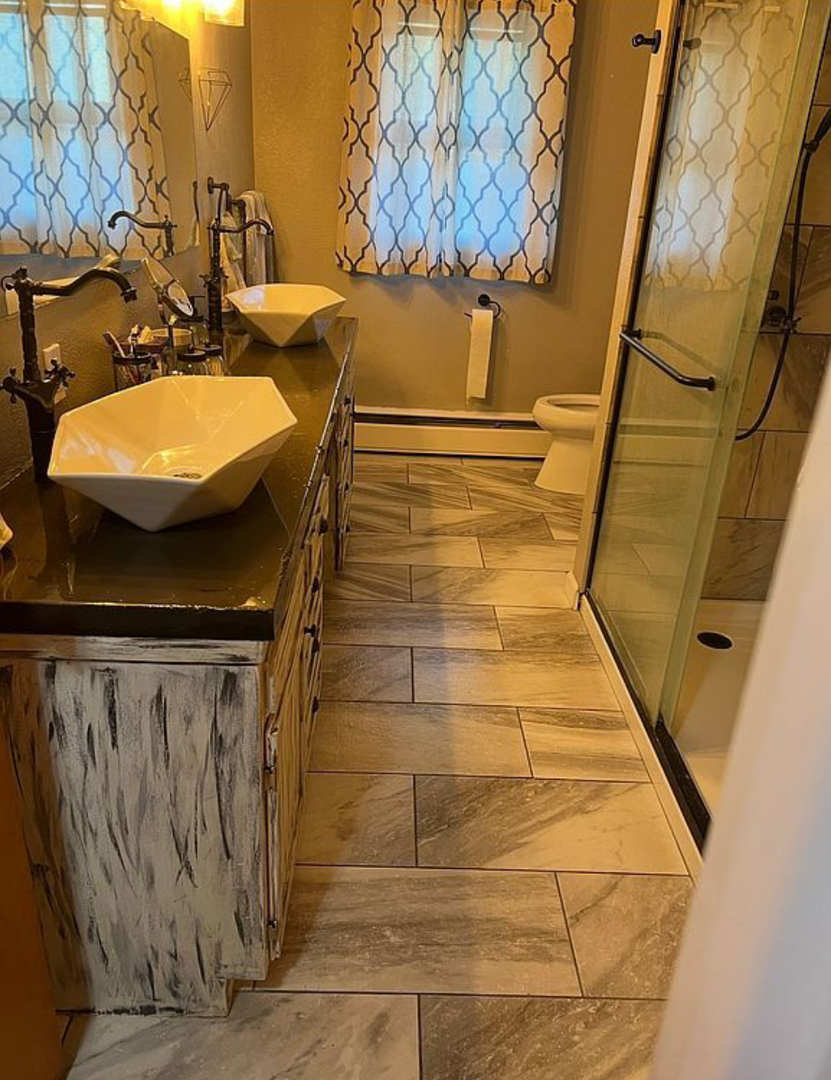 125 West Exchange Street Danvers, IL 61732 - Photo 24 of 66 a bathroom with a toilet and a shower