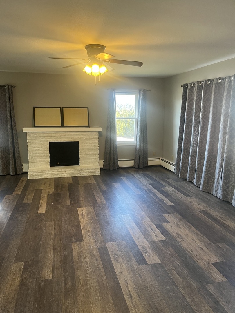 125 West Exchange Street Danvers, IL 61732 - Photo 3 of 66 a view of a livingroom with a fireplace