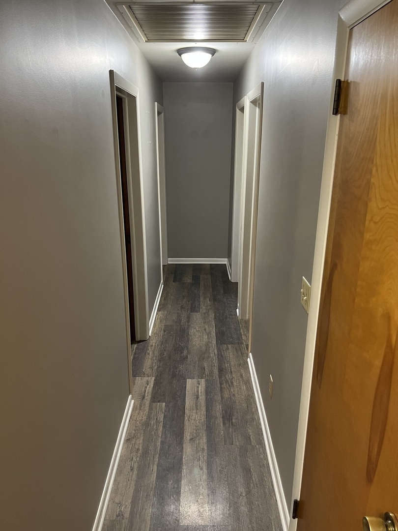 125 West Exchange Street Danvers, IL 61732 - Photo 35 of 66 a view of hallway with wooden floor