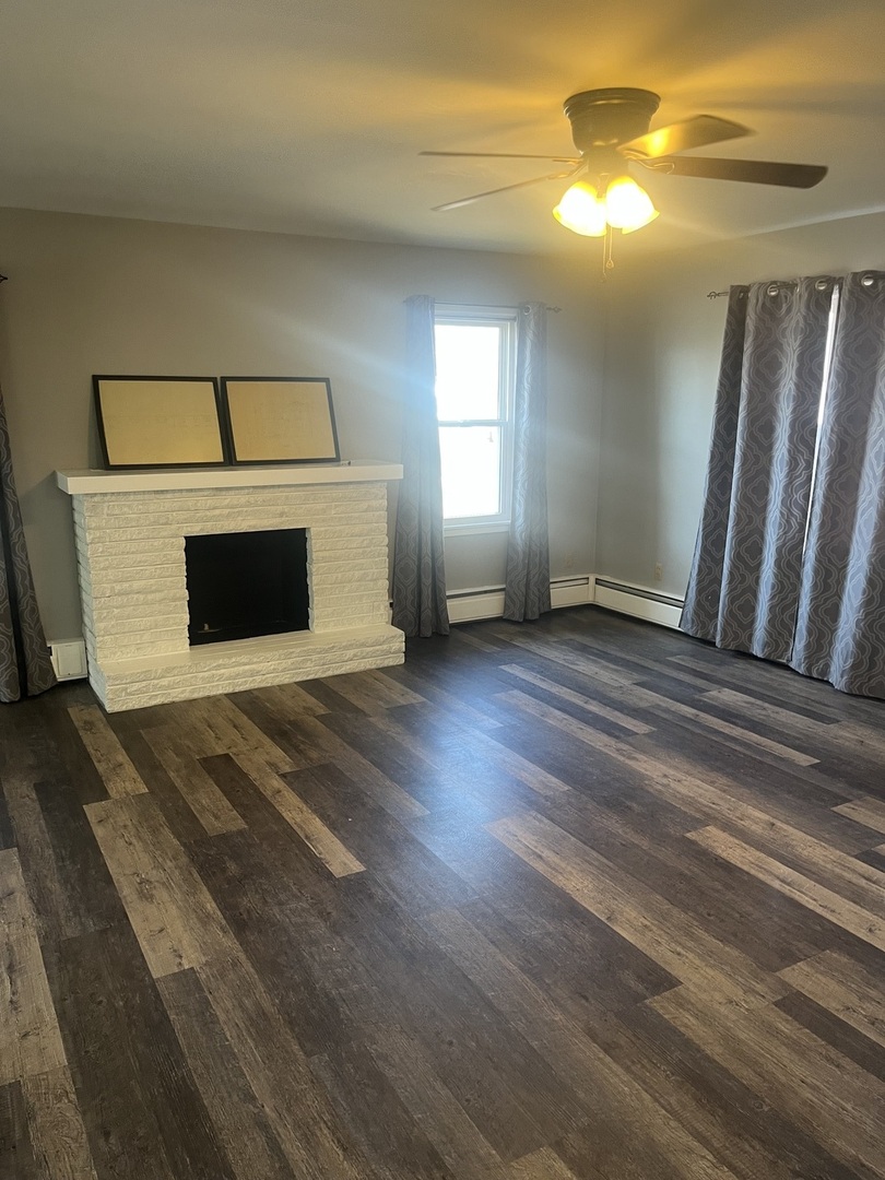 125 West Exchange Street Danvers, IL 61732 - Photo 4 of 66 a view of a livingroom with a fireplace