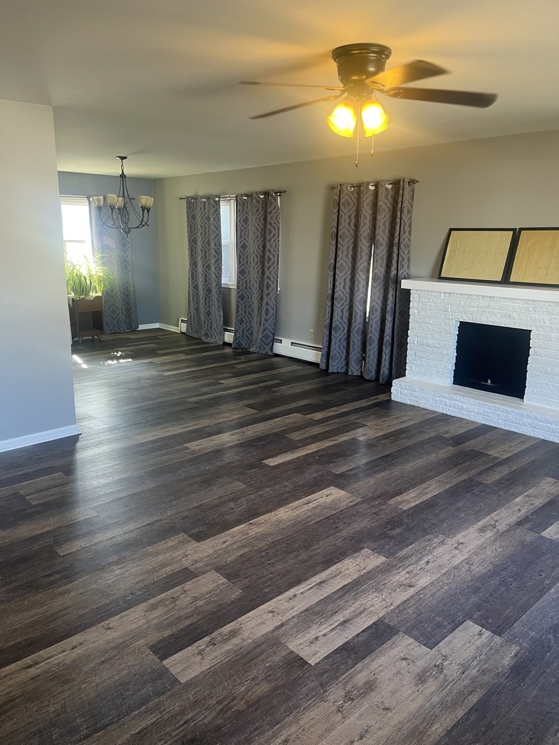 125 West Exchange Street Danvers, IL 61732 - Photo 5 of 66 a view of a livingroom with wooden floor