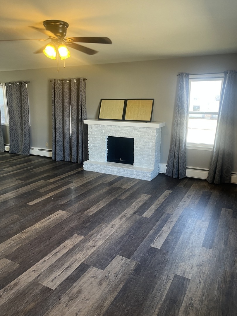125 West Exchange Street Danvers, IL 61732 - Photo 6 of 66 a view of a livingroom with a staircase