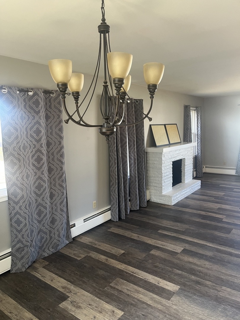 125 West Exchange Street Danvers, IL 61732 - Photo 9 of 66 a view of a livingroom with furniture and chandelier