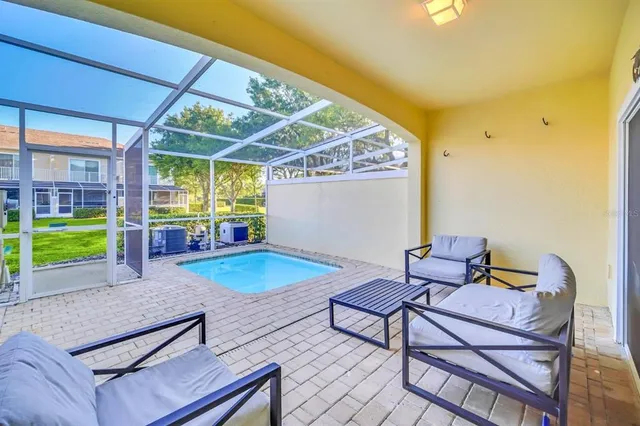 a outdoor space with lots of furniture and tub