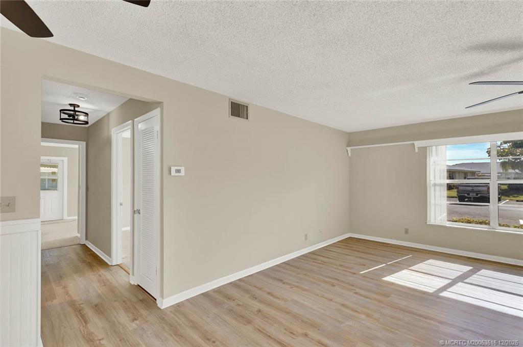 902 Savannas Point Drive, Unit D Fort Pierce, FL 34982 - Photo 12 of 44 wooden floor in an empty room