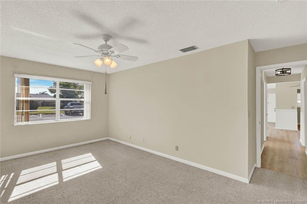 902 Savannas Point Drive, Unit D Fort Pierce, FL 34982 - Photo 14 of 44 a view of an empty room with a window