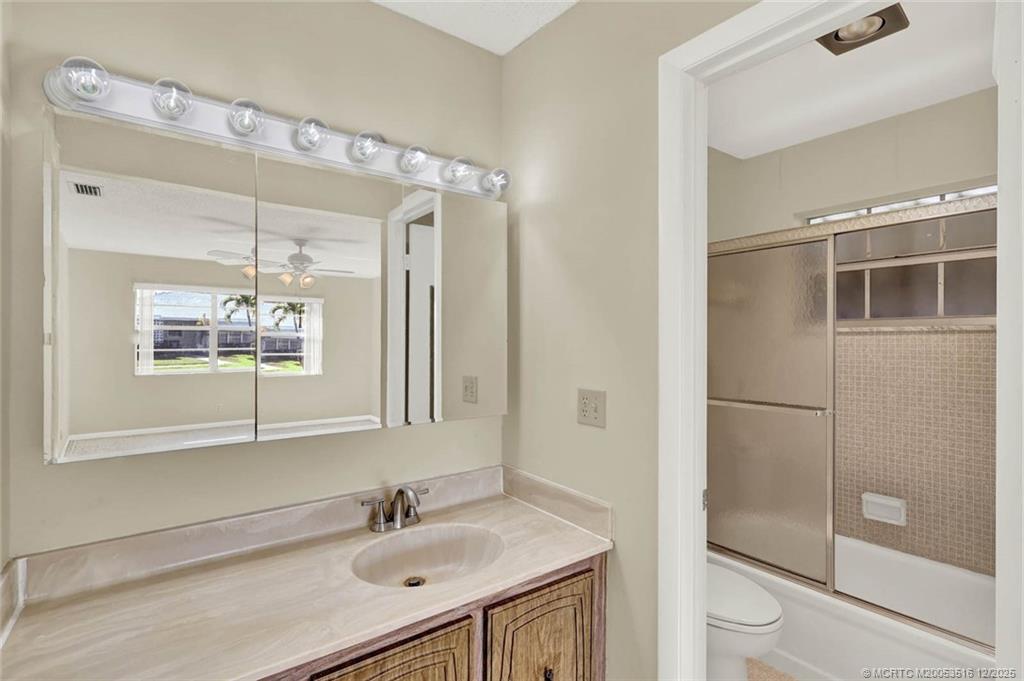 902 Savannas Point Drive, Unit D Fort Pierce, FL 34982 - Photo 17 of 44 a bathroom with a sink and a mirror