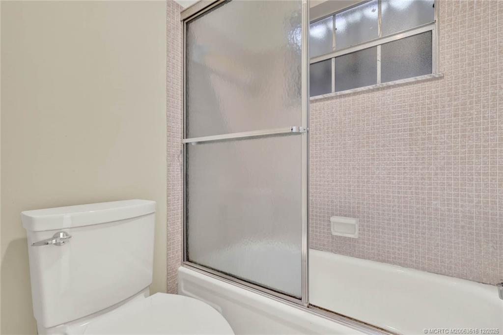 902 Savannas Point Drive, Unit D Fort Pierce, FL 34982 - Photo 18 of 44 a bathroom with a shower and toilet