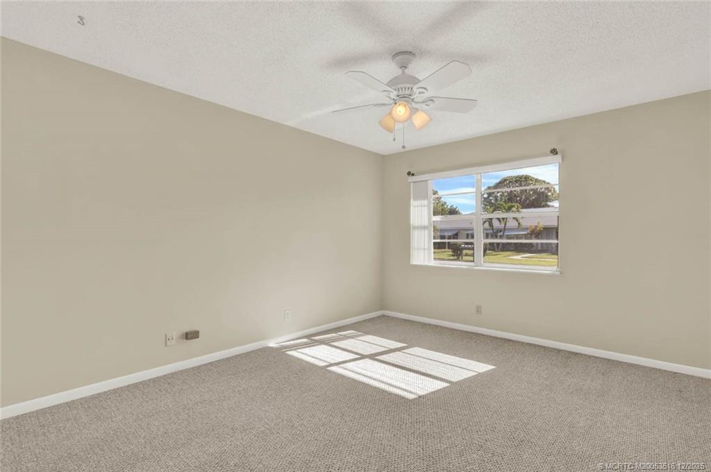 902 Savannas Point Drive, Unit D Fort Pierce, FL 34982 - Photo 20 of 44 an empty room with a window