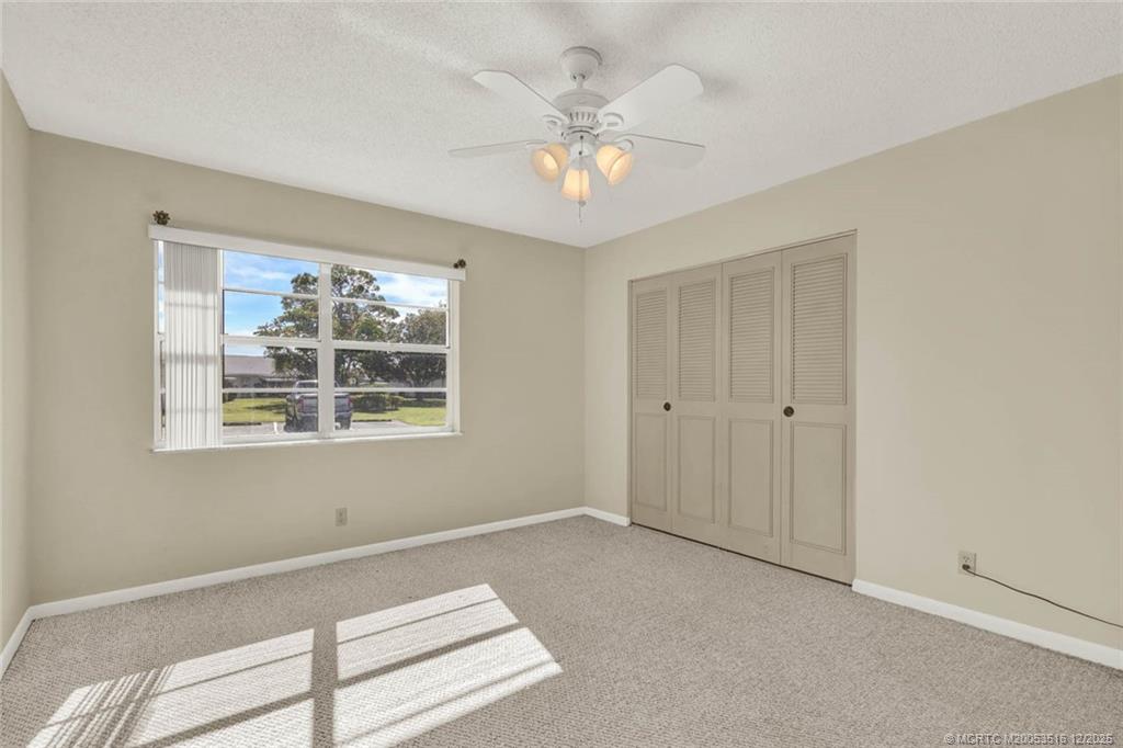 902 Savannas Point Drive, Unit D Fort Pierce, FL 34982 - Photo 21 of 44 a view of an empty room with a window