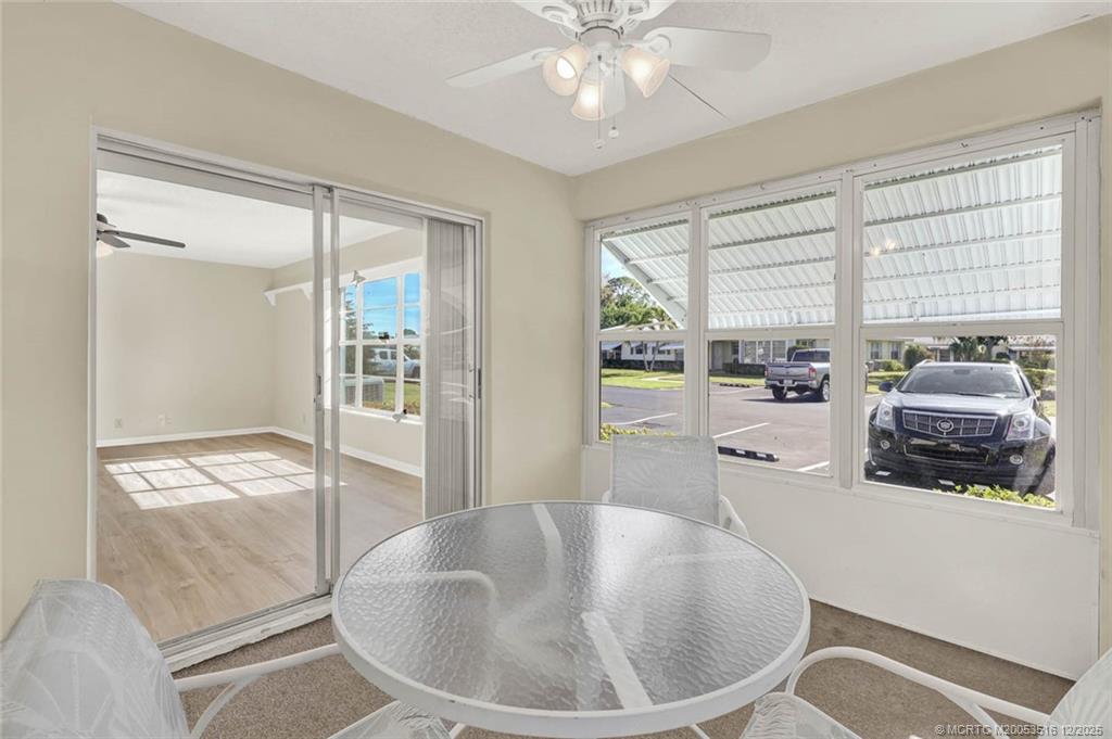 902 Savannas Point Drive, Unit D Fort Pierce, FL 34982 - Photo 27 of 44 a living room with furniture and a large window