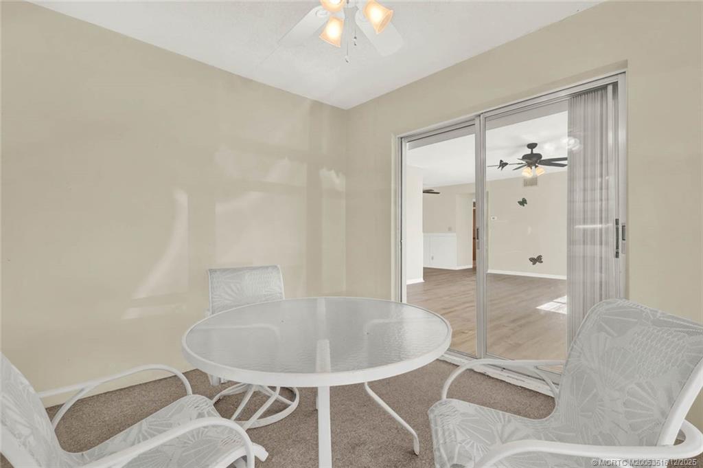 902 Savannas Point Drive, Unit D Fort Pierce, FL 34982 - Photo 28 of 44 a view of a livingroom with furniture and front door