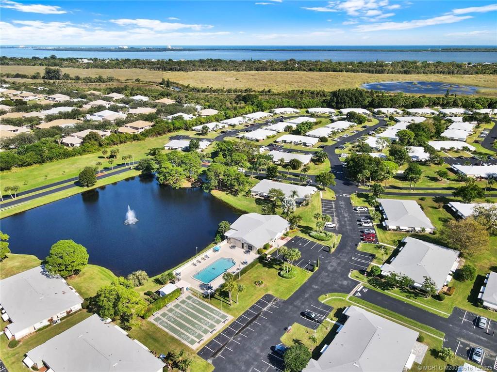 902 Savannas Point Drive, Unit D Fort Pierce, FL 34982 - Photo 35 of 44 an aerial view of residential houses with outdoor space