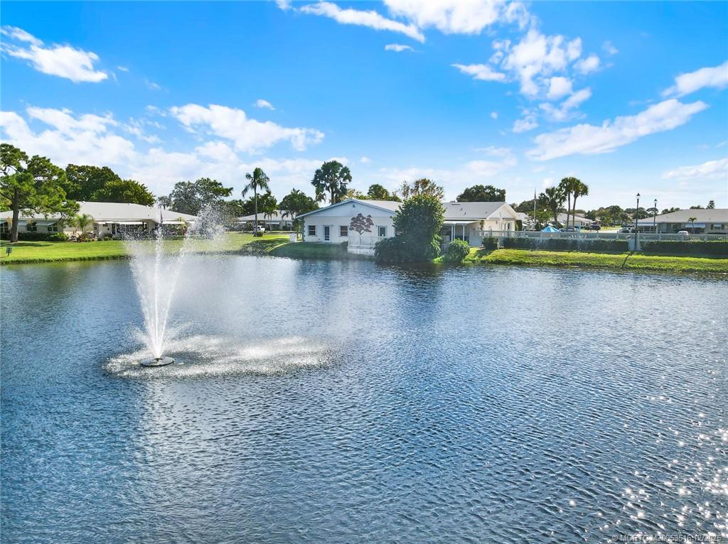 902 Savannas Point Drive, Unit D Fort Pierce, FL 34982 - Photo 36 of 44 a view of a lake with houses