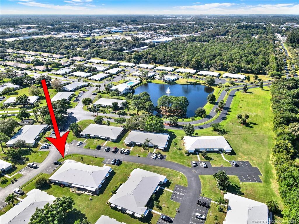 902 Savannas Point Drive, Unit D Fort Pierce, FL 34982 - Photo 41 of 44 an aerial view of a houses with a swimming pool