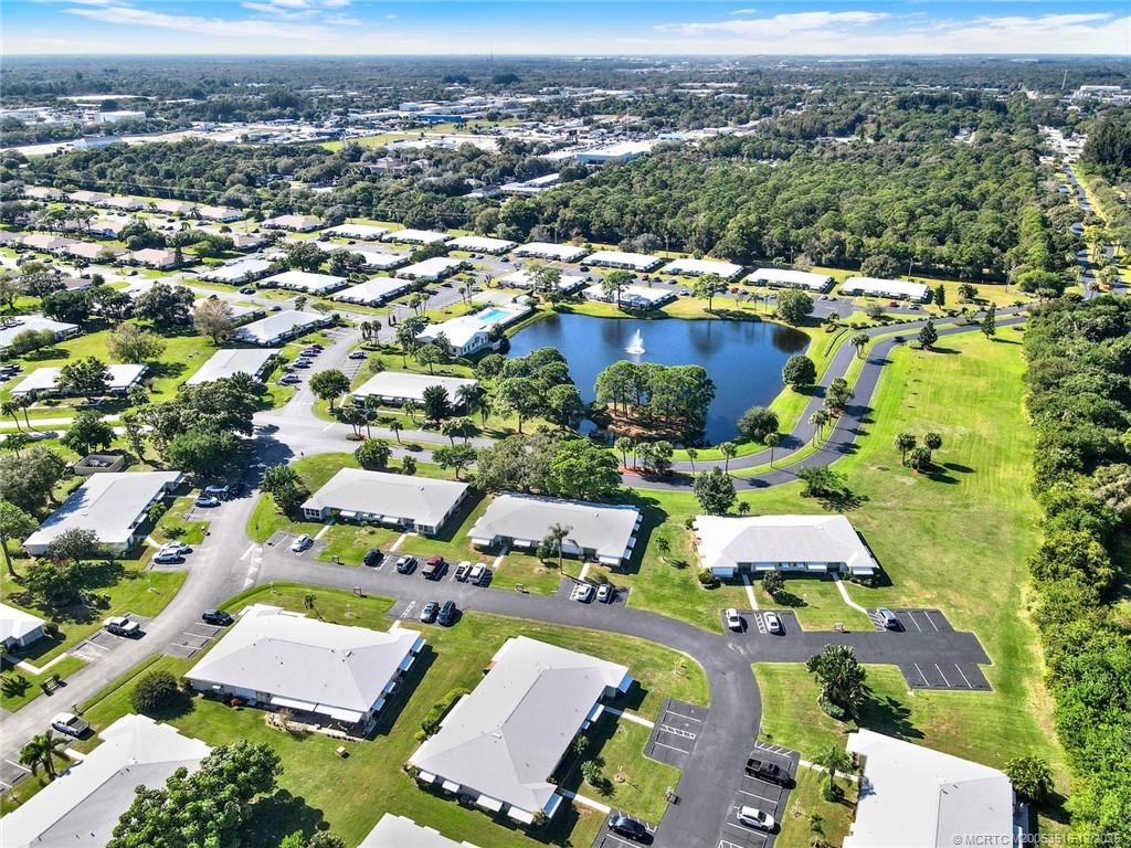 902 Savannas Point Drive, Unit D Fort Pierce, FL 34982 - Photo 42 of 44 an aerial view of residential houses with outdoor space