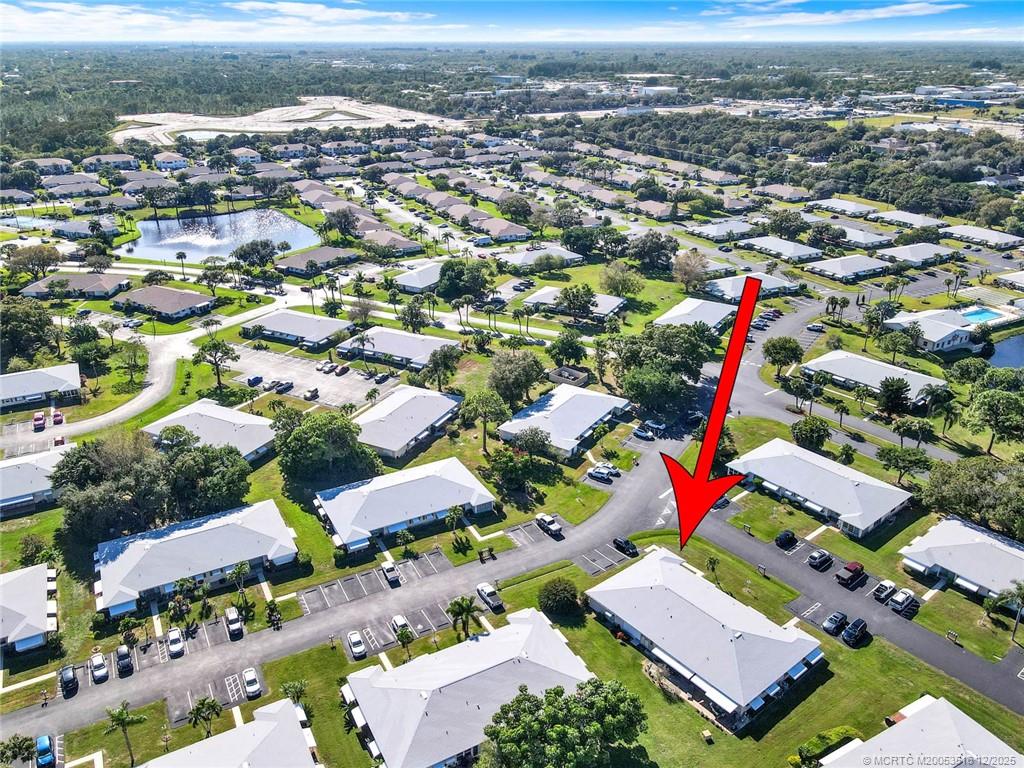 902 Savannas Point Drive, Unit D Fort Pierce, FL 34982 - Photo 43 of 44 an aerial view of residential houses with outdoor space