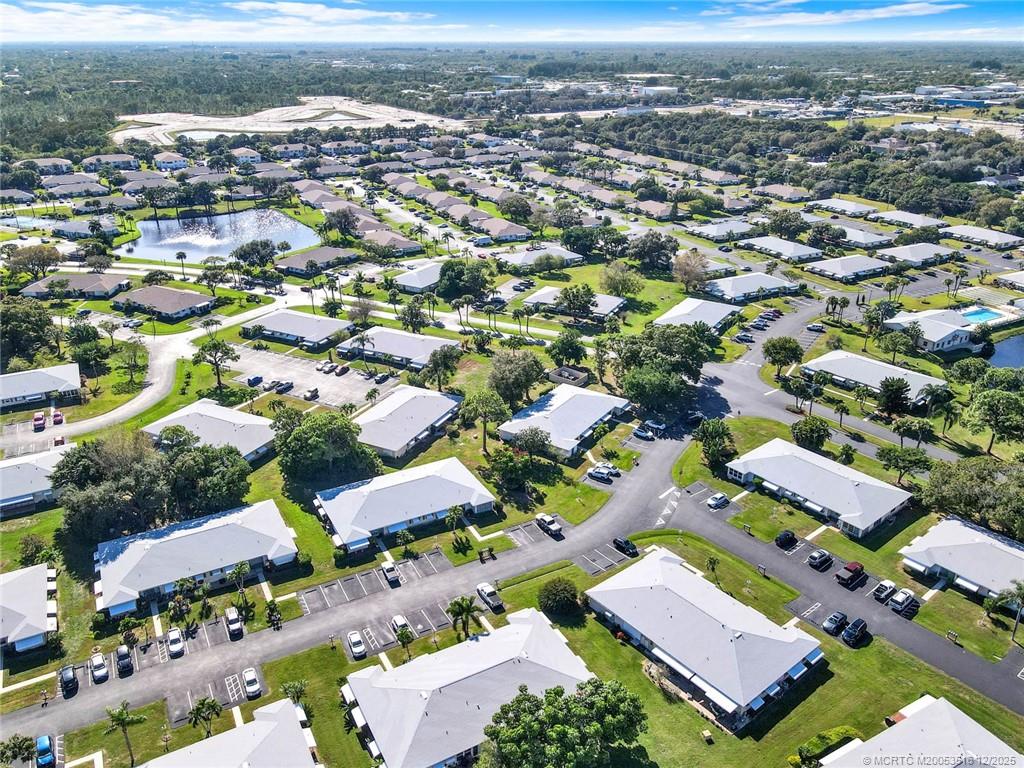 902 Savannas Point Drive, Unit D Fort Pierce, FL 34982 - Photo 44 of 44 an aerial view of residential houses with outdoor space