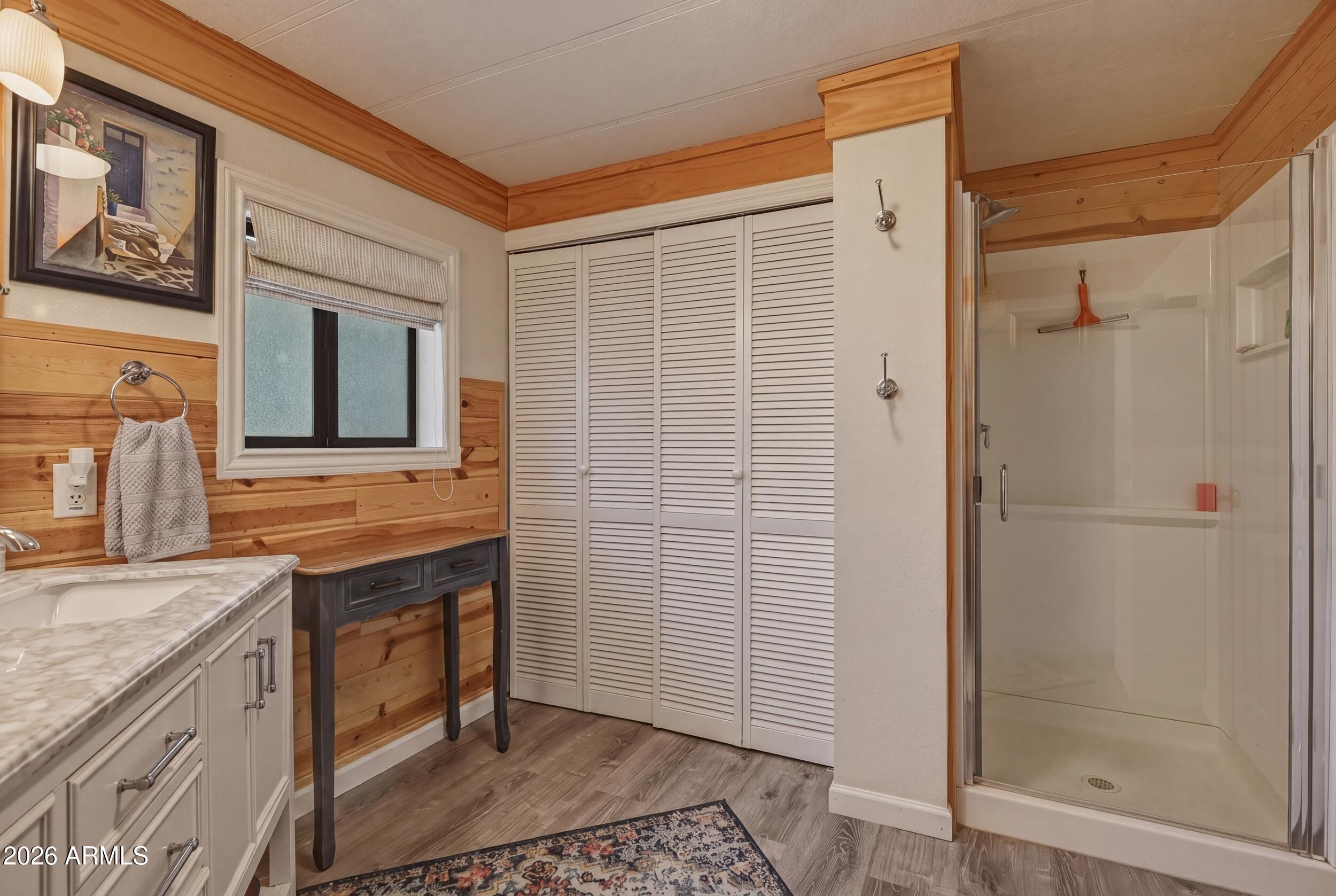 1108 North William Tell Circle Payson, AZ 85541 - Photo 25 of 32 a bathroom with a sink a mirror and a shower