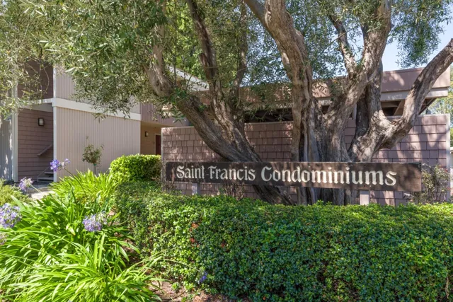 a view of outdoor space with signage and flags