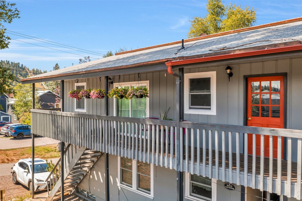 259 6th Street, Unit 8 Steamboat Springs, CO 80487 - Photo 12 of 33 a view of a house with a wooden fence