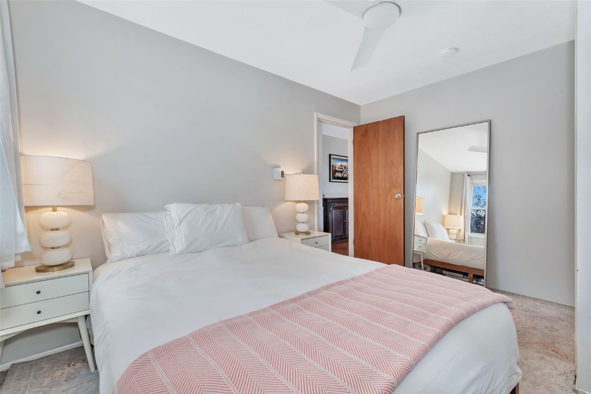 259 6th Street, Unit 8 Steamboat Springs, CO 80487 - Photo 18 of 33 a bedroom with a bed and a lamp