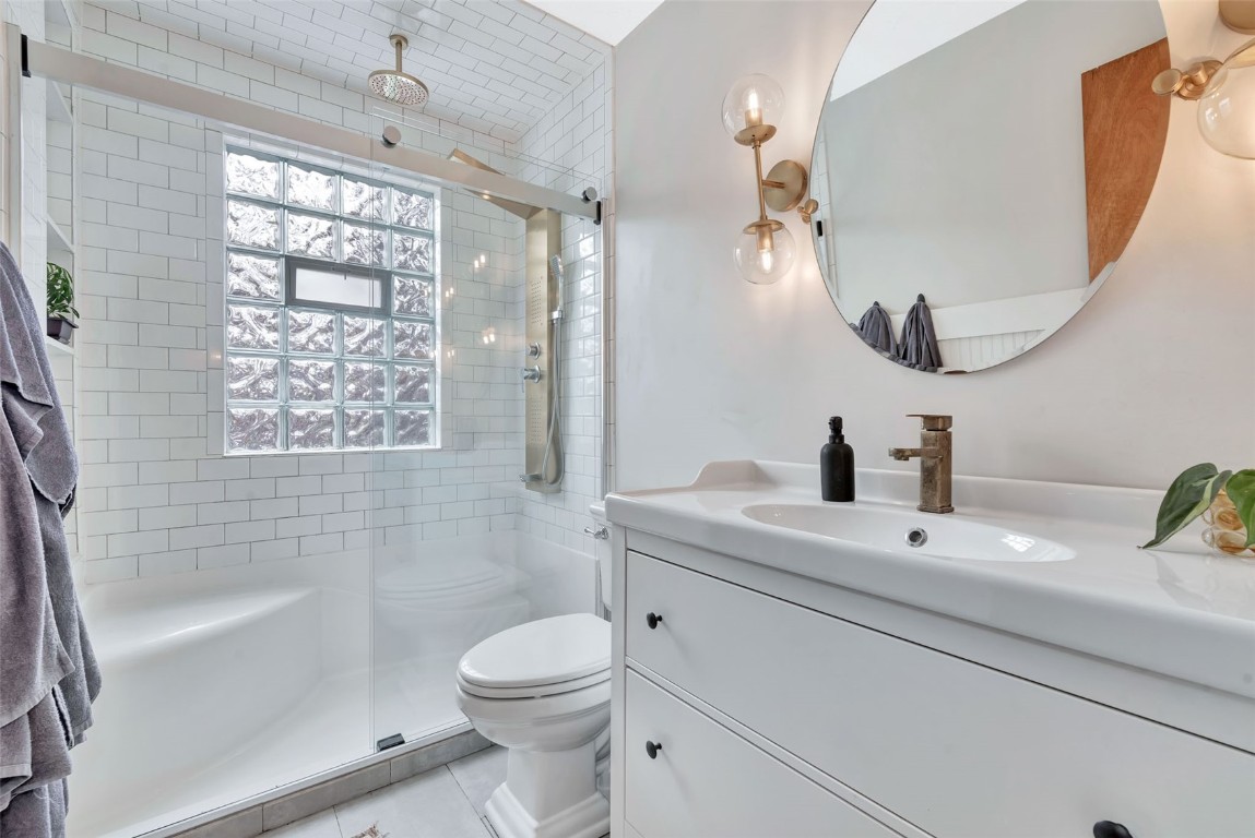 259 6th Street, Unit 8 Steamboat Springs, CO 80487 - Photo 19 of 33 a bathroom with a sink a toilet and shower
