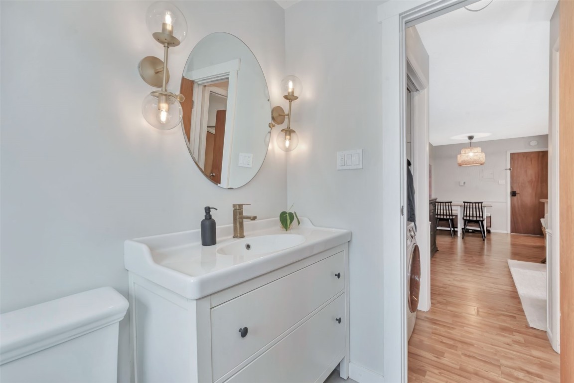 259 6th Street, Unit 8 Steamboat Springs, CO 80487 - Photo 21 of 33 a bathroom with a toilet a sink and a mirror