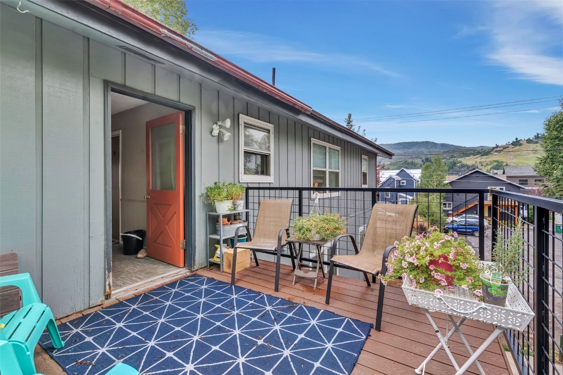 259 6th Street, Unit 8 Steamboat Springs, CO 80487 - Photo 24 of 33 a balcony with furniture and a potted plant