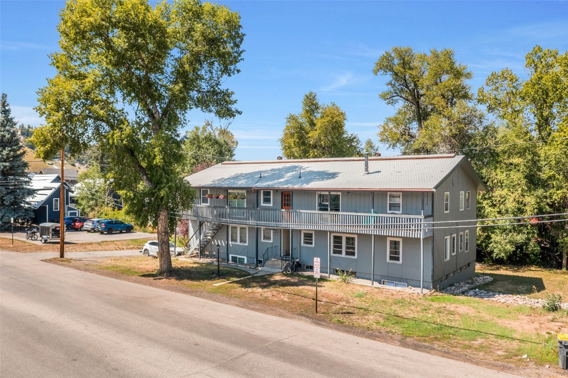 259 6th Street, Unit 8 Steamboat Springs, CO 80487 - Photo 30 of 33 a view of a house with a yard and tree s