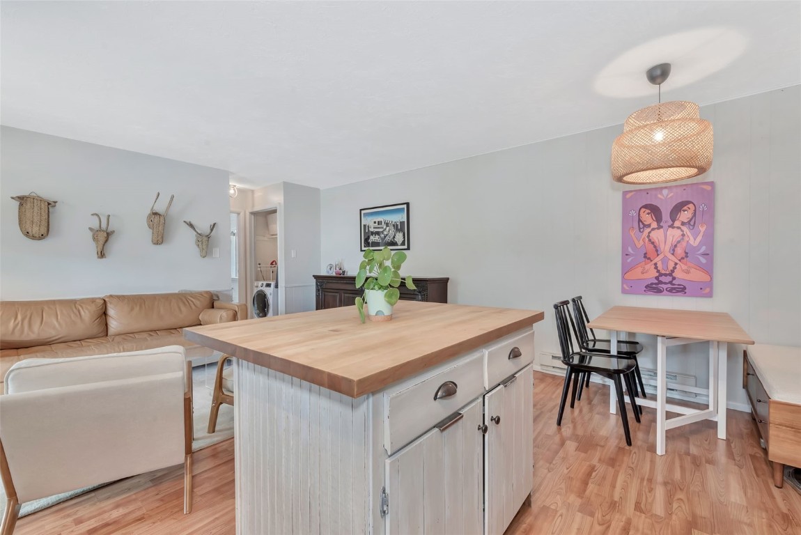 259 6th Street, Unit 8 Steamboat Springs, CO 80487 - Photo 4 of 33 a view of a dining room with furniture and wooden floor