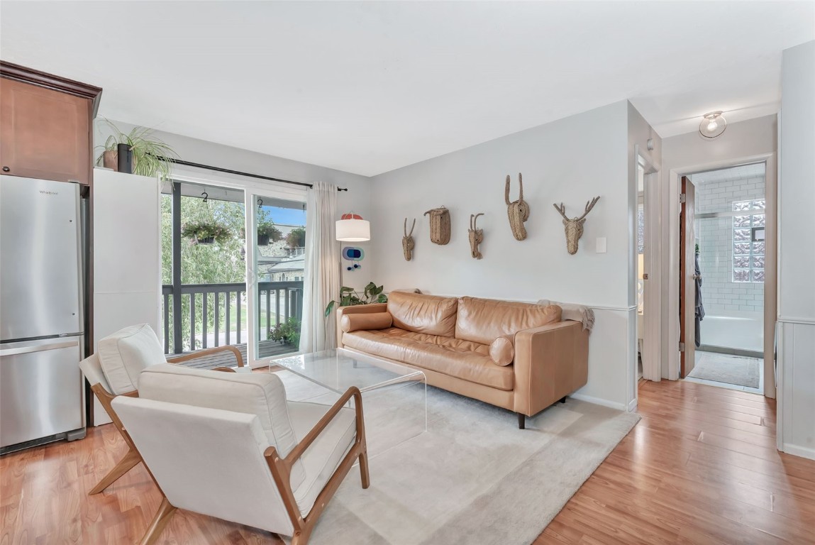 259 6th Street, Unit 8 Steamboat Springs, CO 80487 - Photo 7 of 33 a living room with furniture and a large window