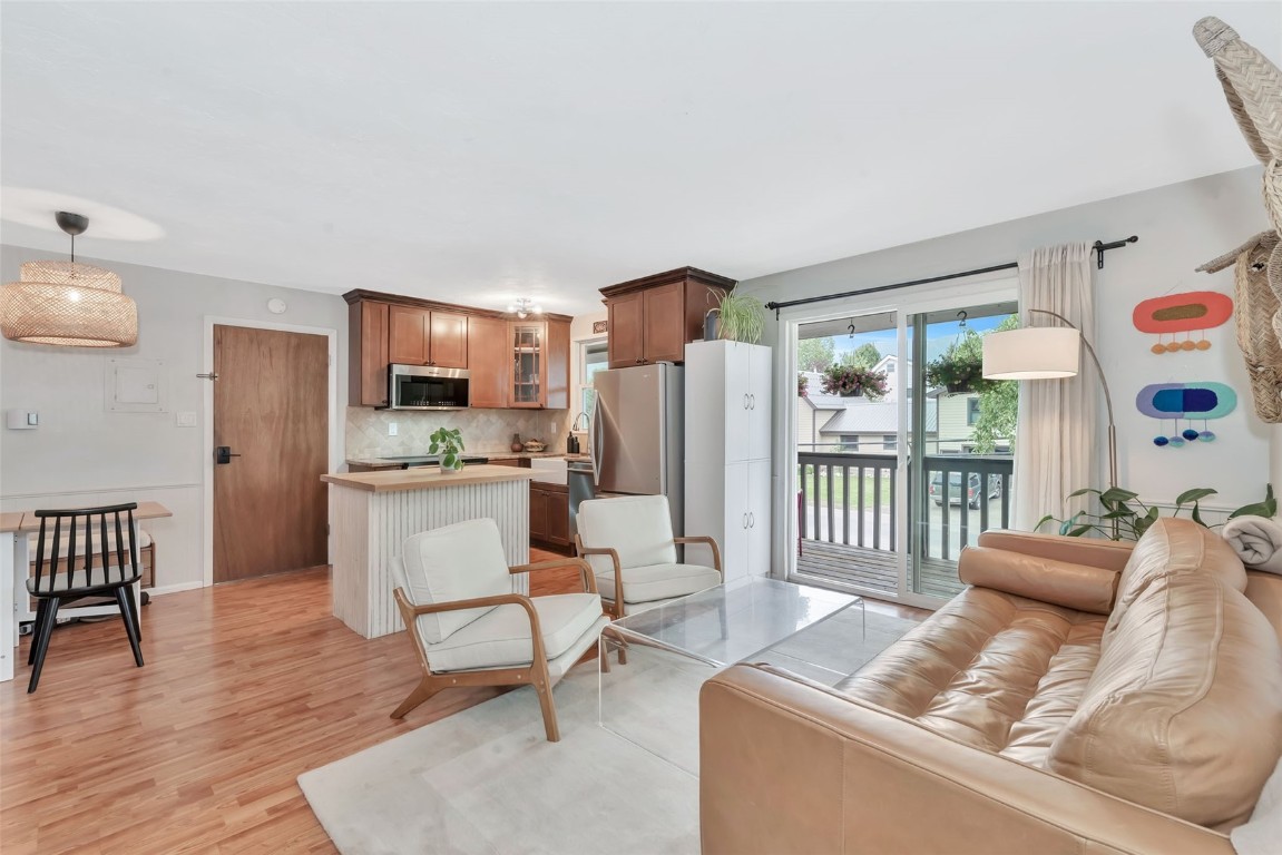 259 6th Street, Unit 8 Steamboat Springs, CO 80487 - Photo 8 of 33 a living room with furniture and a large window