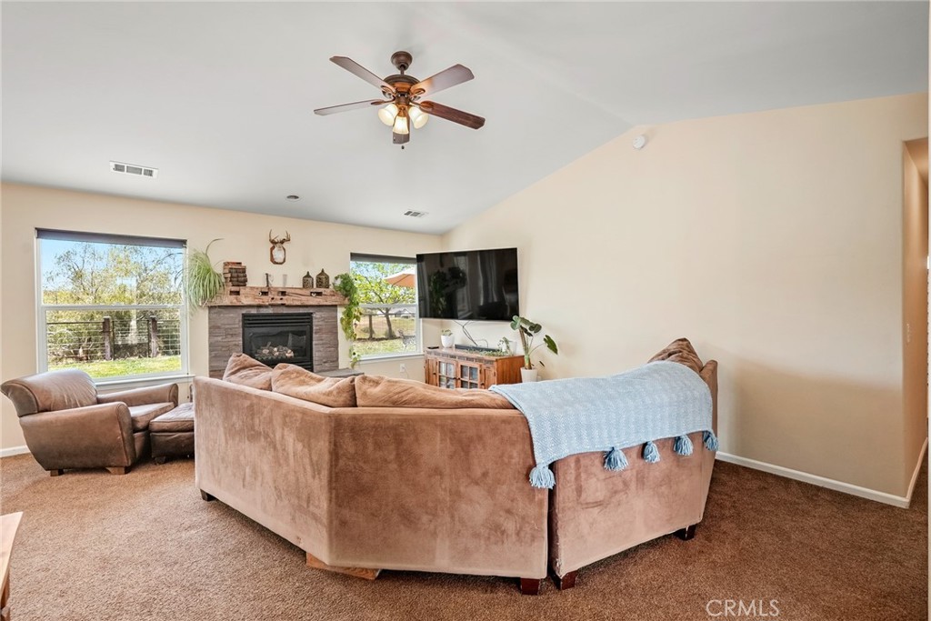 5950 Forked Horn Place Paso Robles, CA 93446 - Photo 11 of 31 a living room with furniture and a flat screen tv