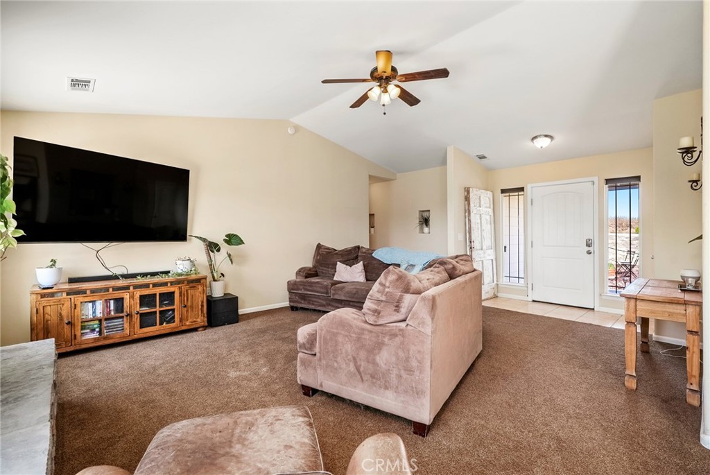 5950 Forked Horn Place Paso Robles, CA 93446 - Photo 12 of 31 a living room with furniture and a flat screen tv