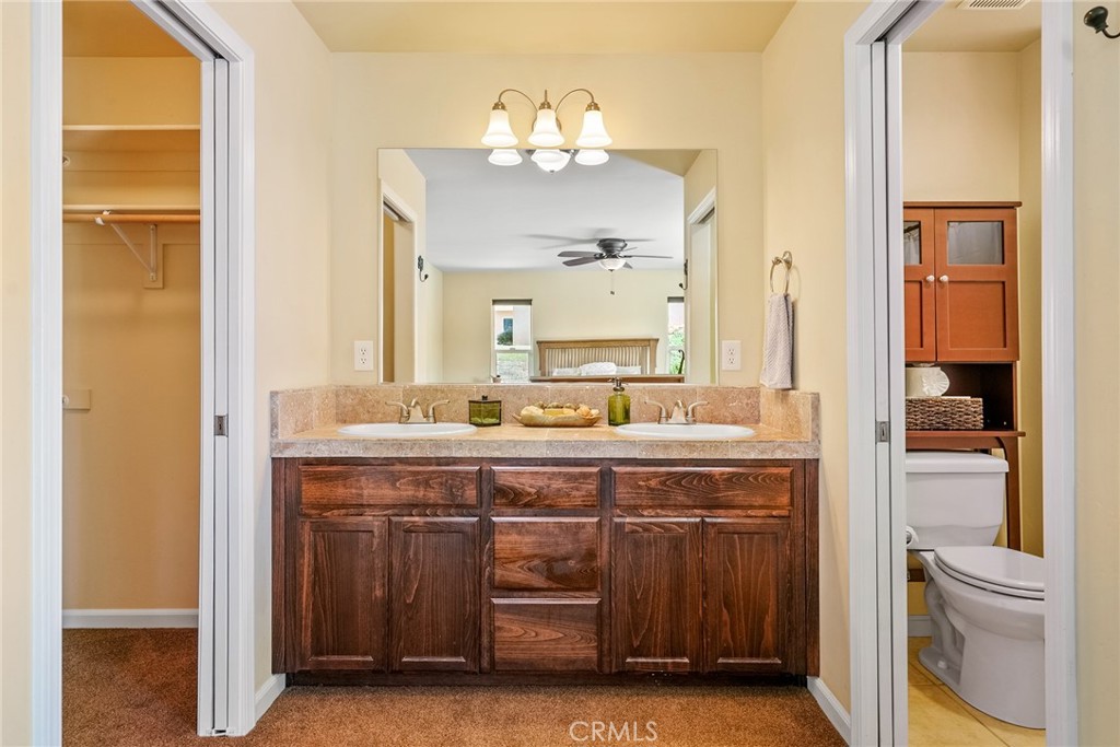 5950 Forked Horn Place Paso Robles, CA 93446 - Photo 18 of 31 a spacious bathroom with a double vanity sink and a mirror