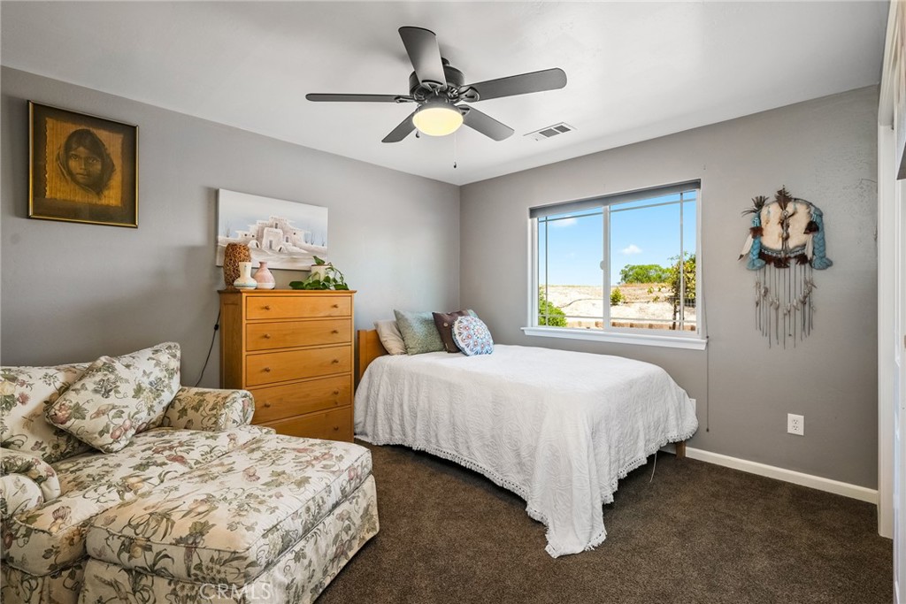 5950 Forked Horn Place Paso Robles, CA 93446 - Photo 20 of 31 a bedroom with a bed and window