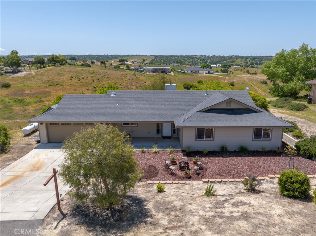 5950 Forked Horn Place Paso Robles, CA 93446 - Photo 3 of 31 an aerial view of a house with a yard and lake view