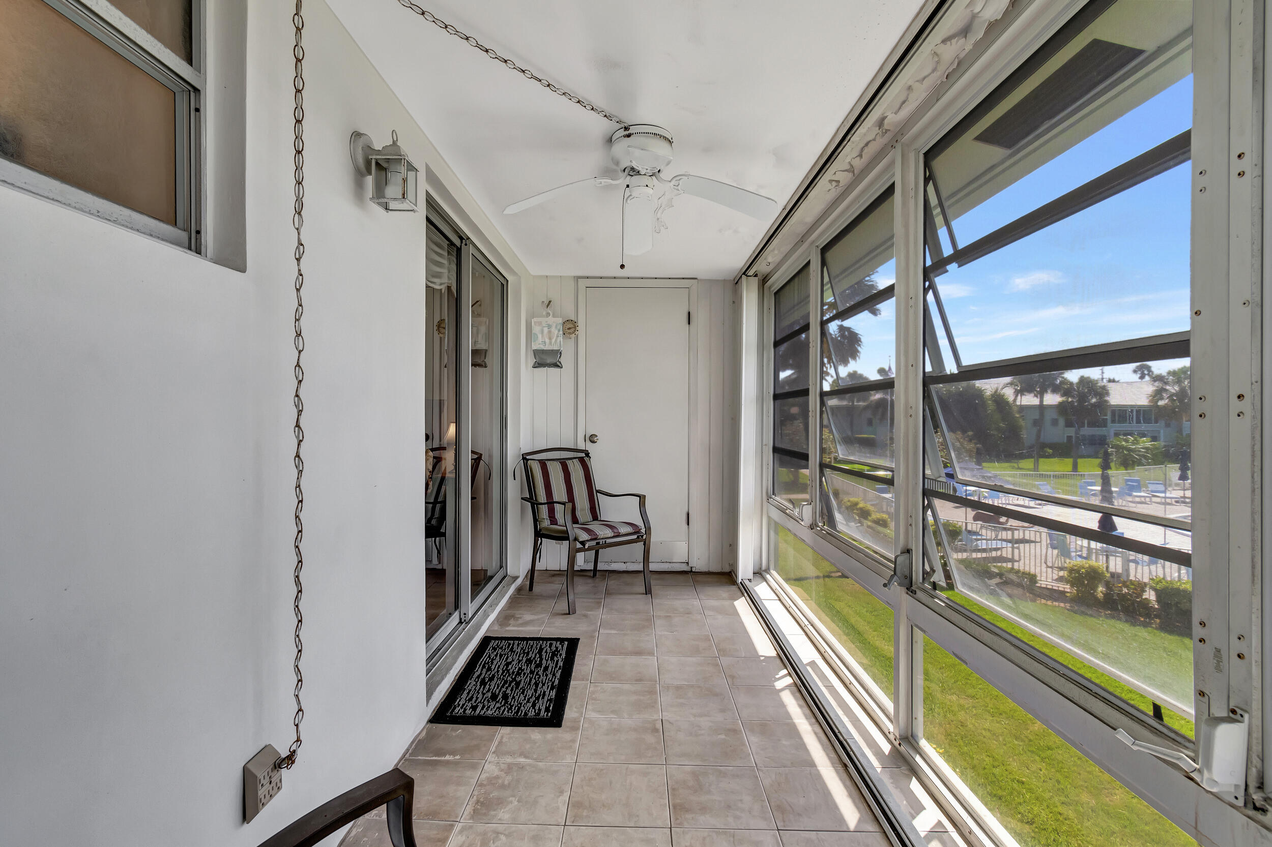 5540 North Ocean Boulevard, Unit 204 Ocean Ridge, FL 33435 - Photo 23 of 52 a hallway with a large mirror on a dresser