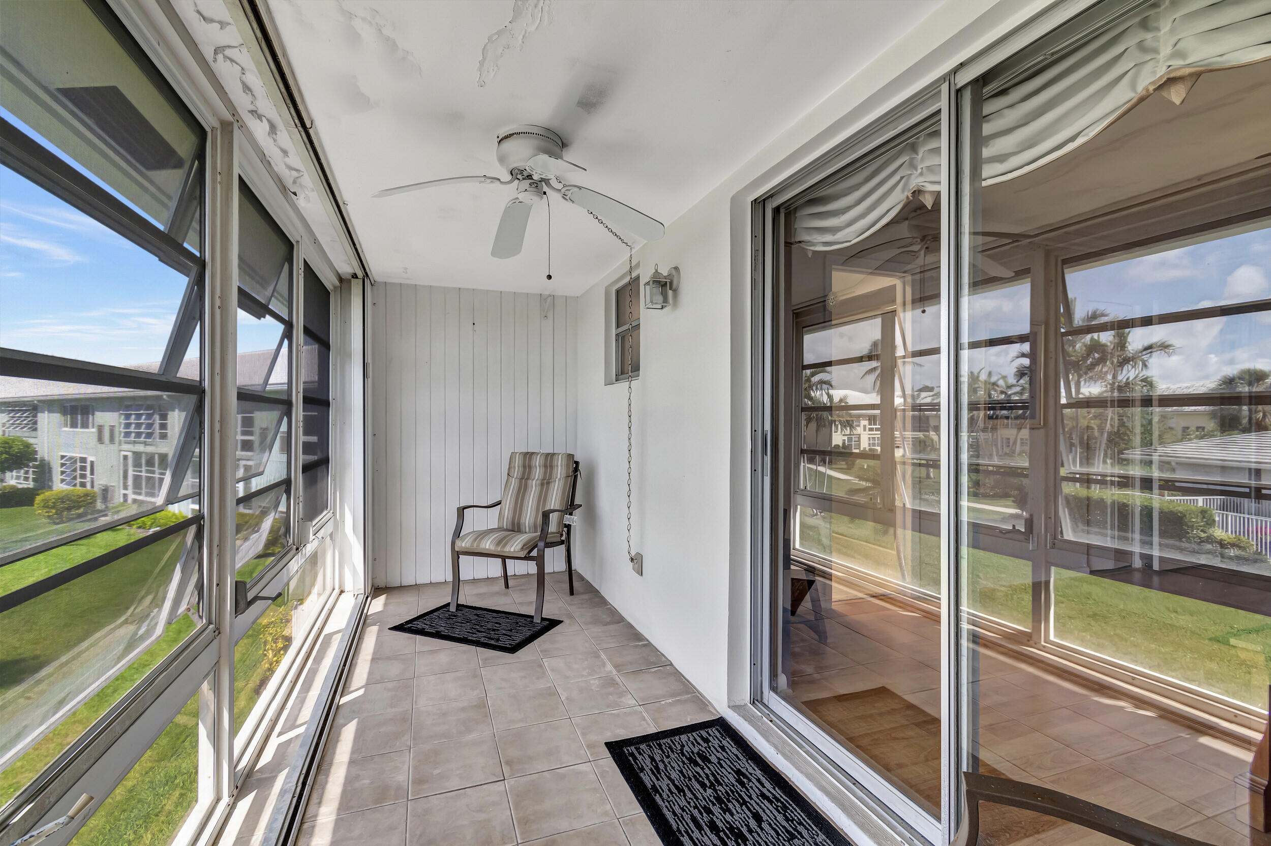 5540 North Ocean Boulevard, Unit 204 Ocean Ridge, FL 33435 - Photo 25 of 52 a view of a hallway with a couch