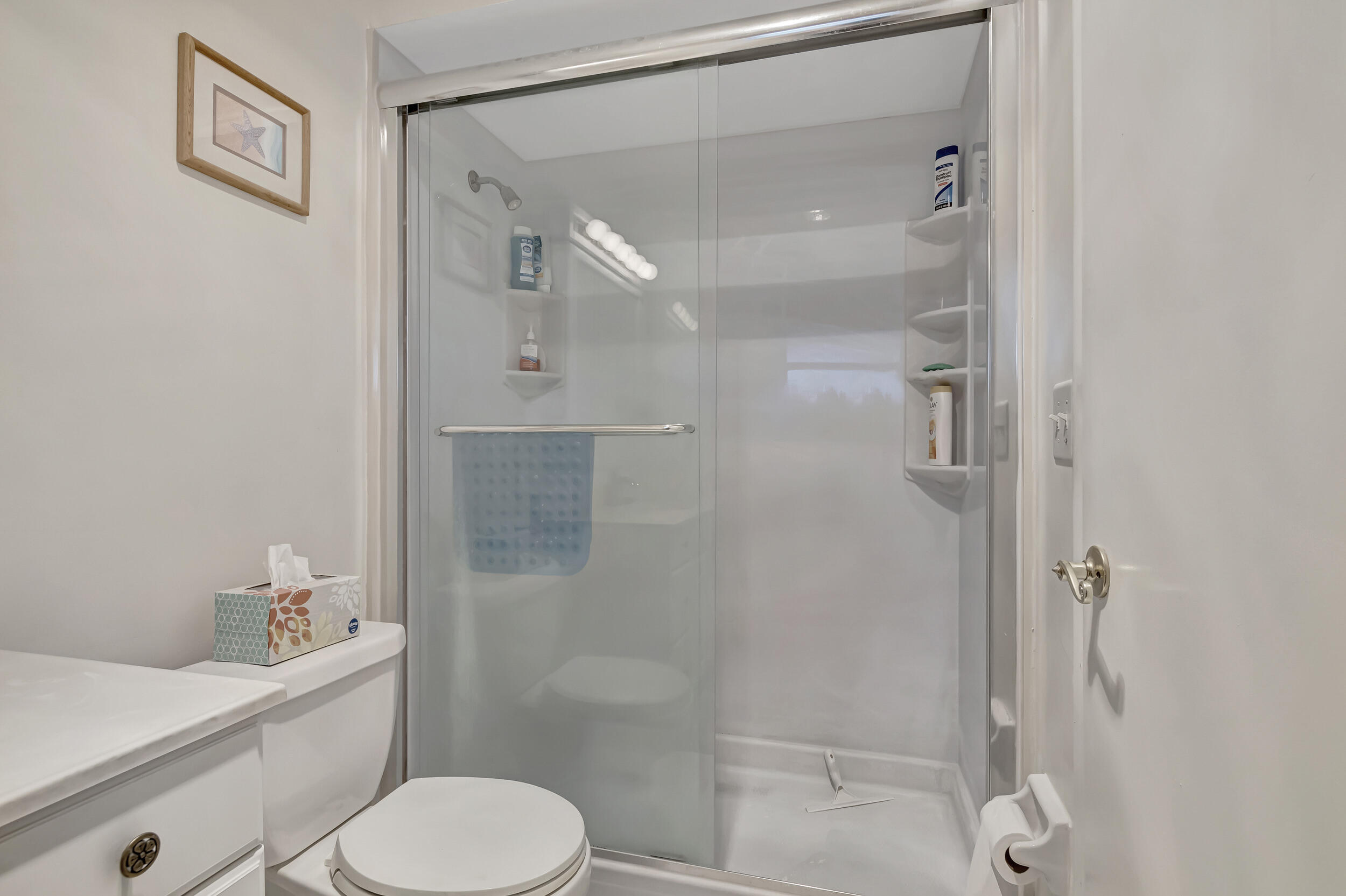 5540 North Ocean Boulevard, Unit 204 Ocean Ridge, FL 33435 - Photo 29 of 52 a bathroom with a toilet sink and shower